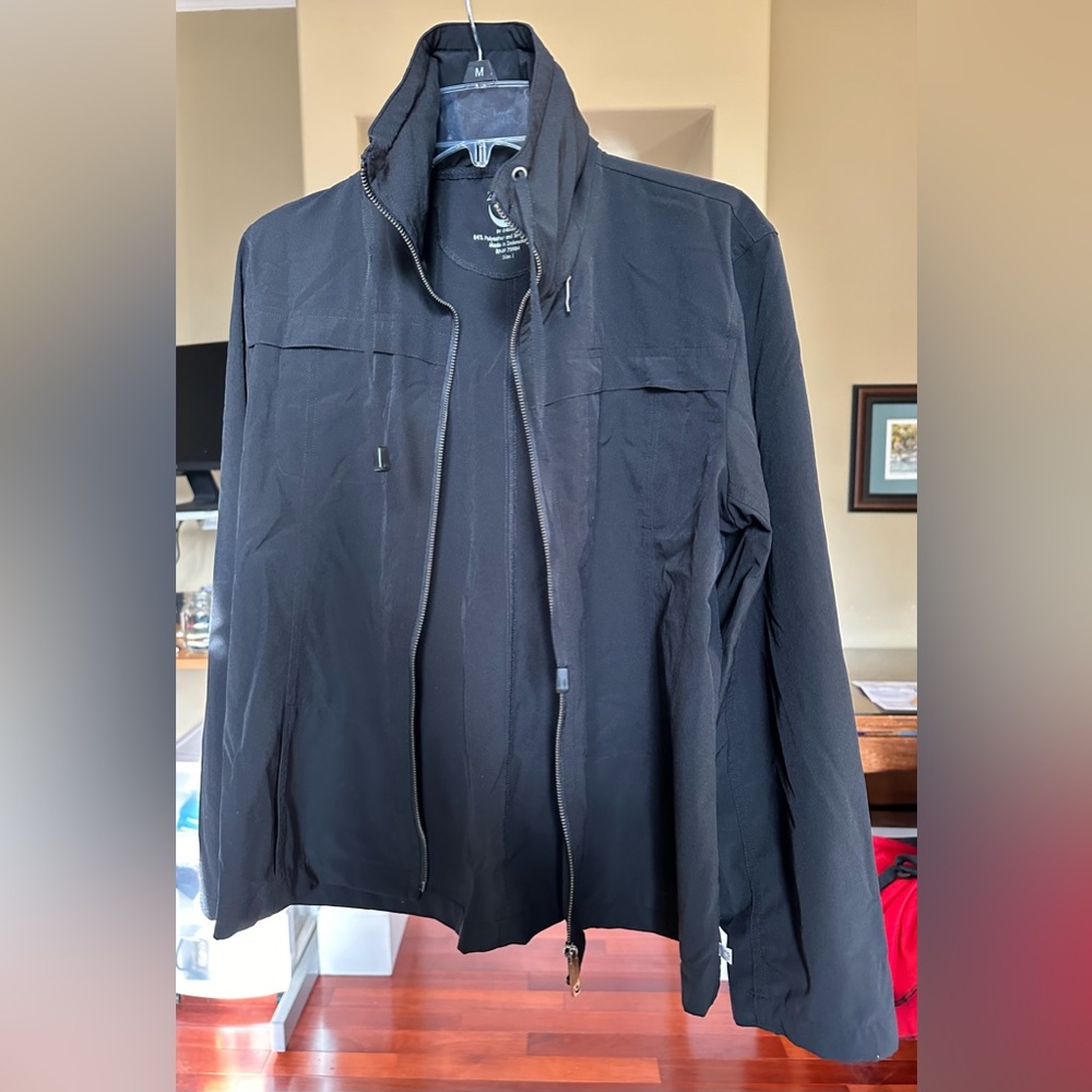 Lightweight Chico’s black zip up. Nylon spandex, collar converts to a hood.